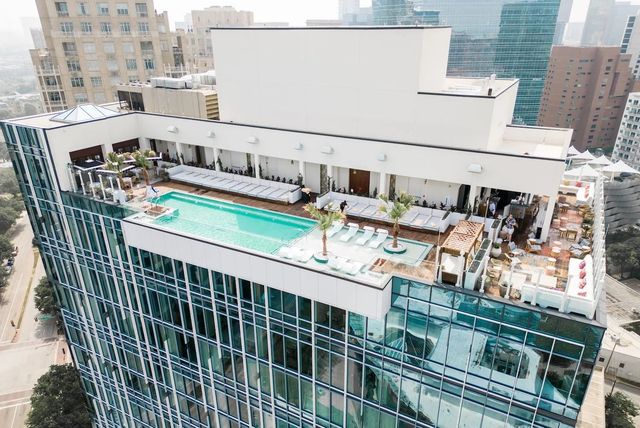 Hotel Swexan Dallas Harwood District Kengo Kuma mirrored tower opened June 2023 rooftop pool