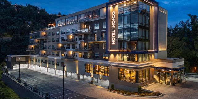 Hotel Indigo Gatlinburg Downtown opened 2025 IHG 136 rooms Altitude rooftop bar largest rooftop Gatlinburg Art Deco Appalachian design Tennessee