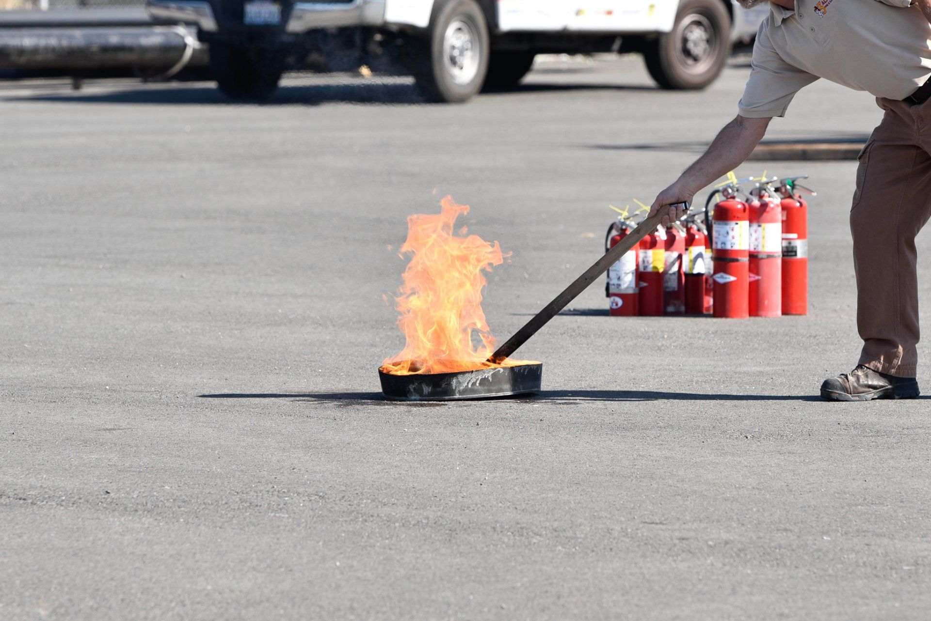 Fire Extinguisher Safety Training  Class picture before  with fire burning in container