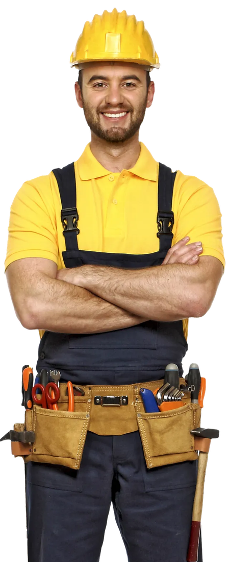 A construction worker in a yellow hard hat, smiling with arms crossed, wearing a yellow shirt and navy overalls.