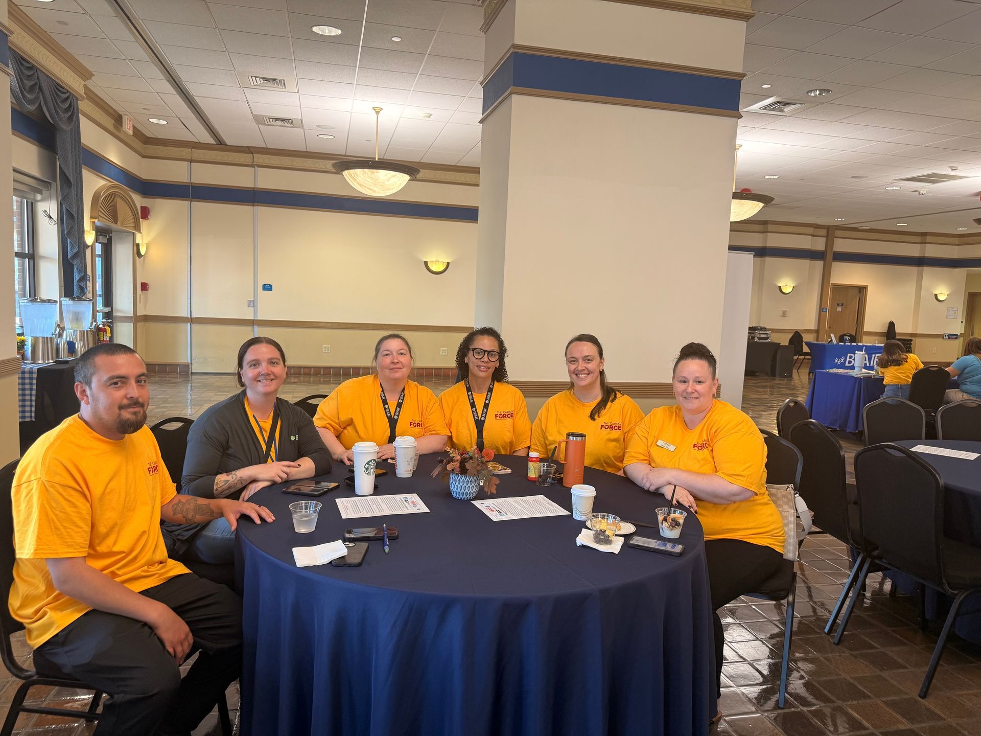A group of BFAIR managers attend the Western MA Caring Force Rally in yellow shirts