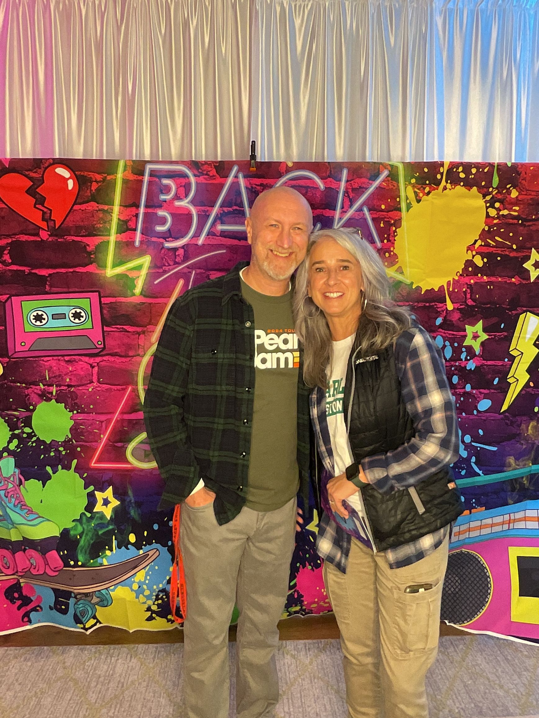 Guests enjoying the BFAIR 30th Anniversary celebration dressed in 90s-themed attire