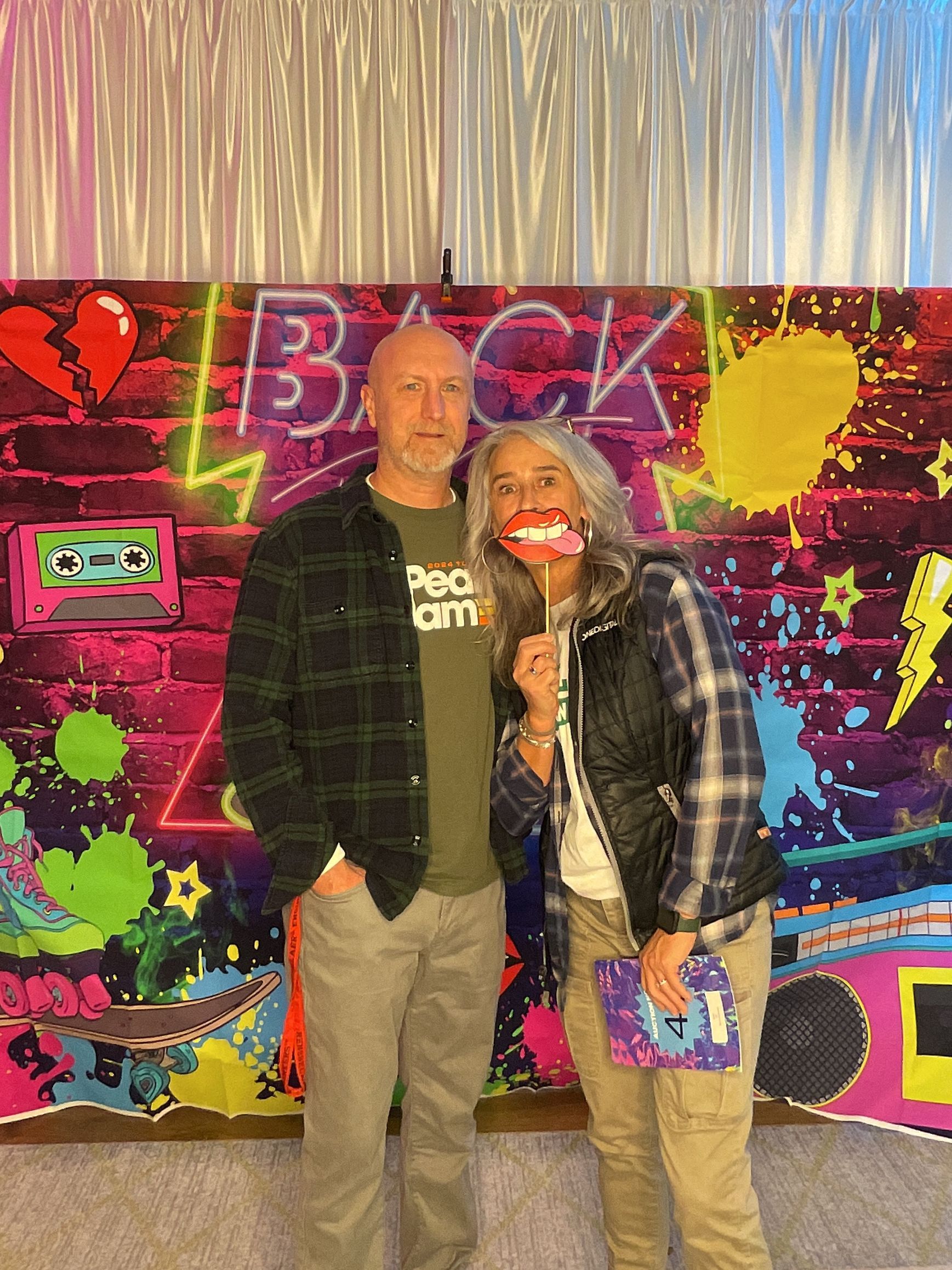 Guests enjoying the BFAIR 30th Anniversary celebration dressed in 90s-themed attire