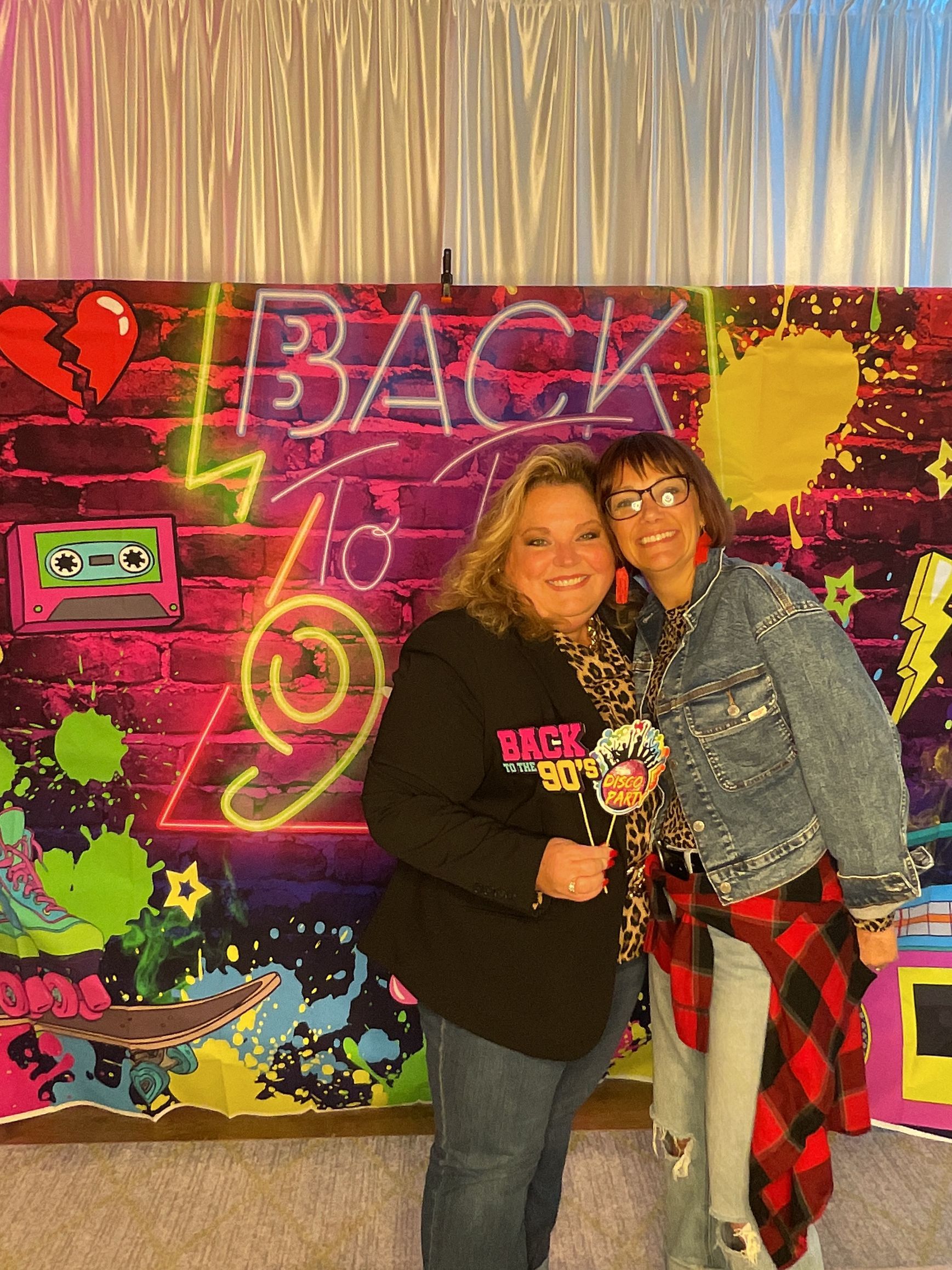 Guests enjoying the BFAIR 30th Anniversary celebration dressed in 90s-themed attire