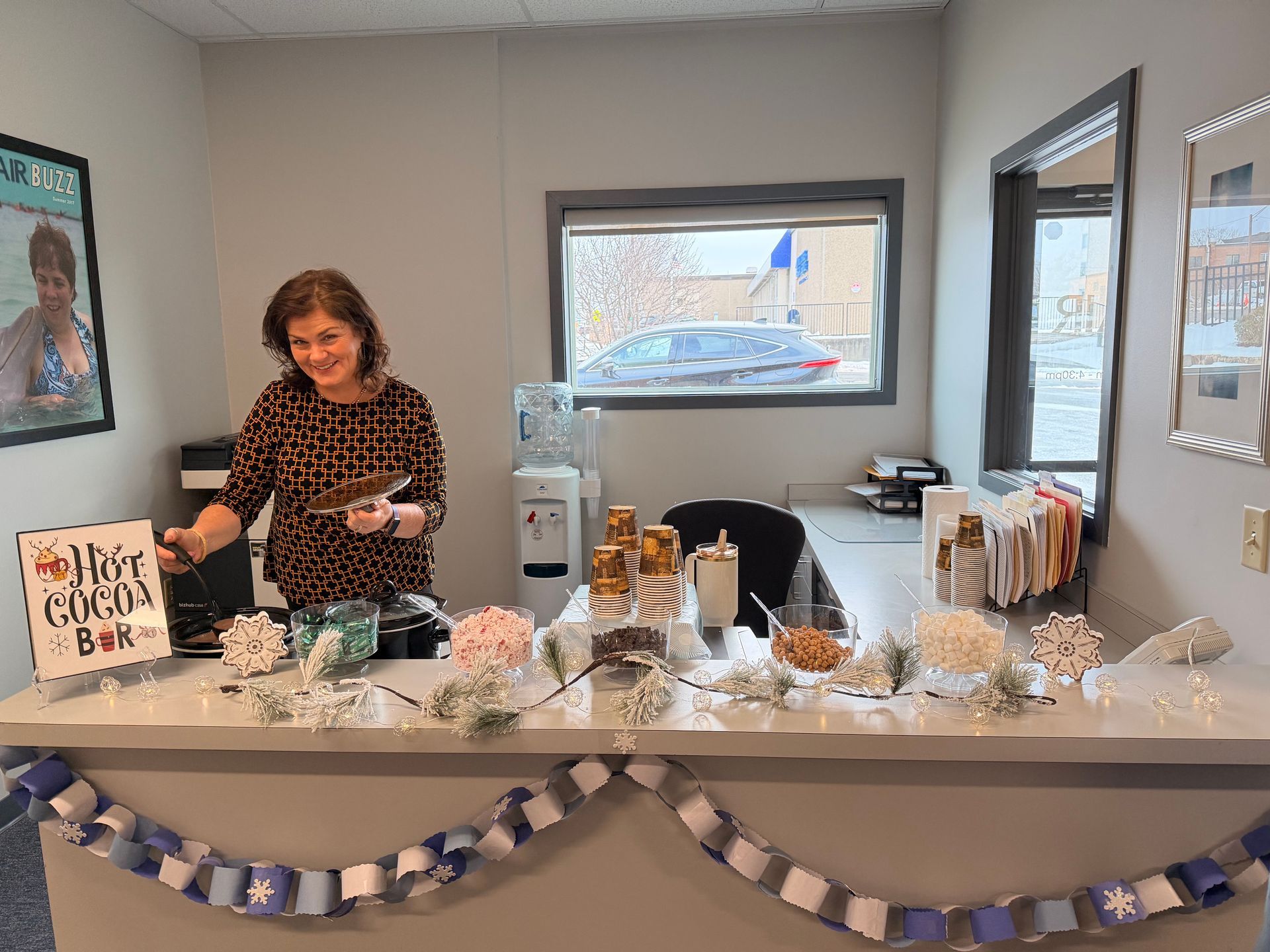 Kristen Wampler serving hot cocoa at the hot cocoa bar