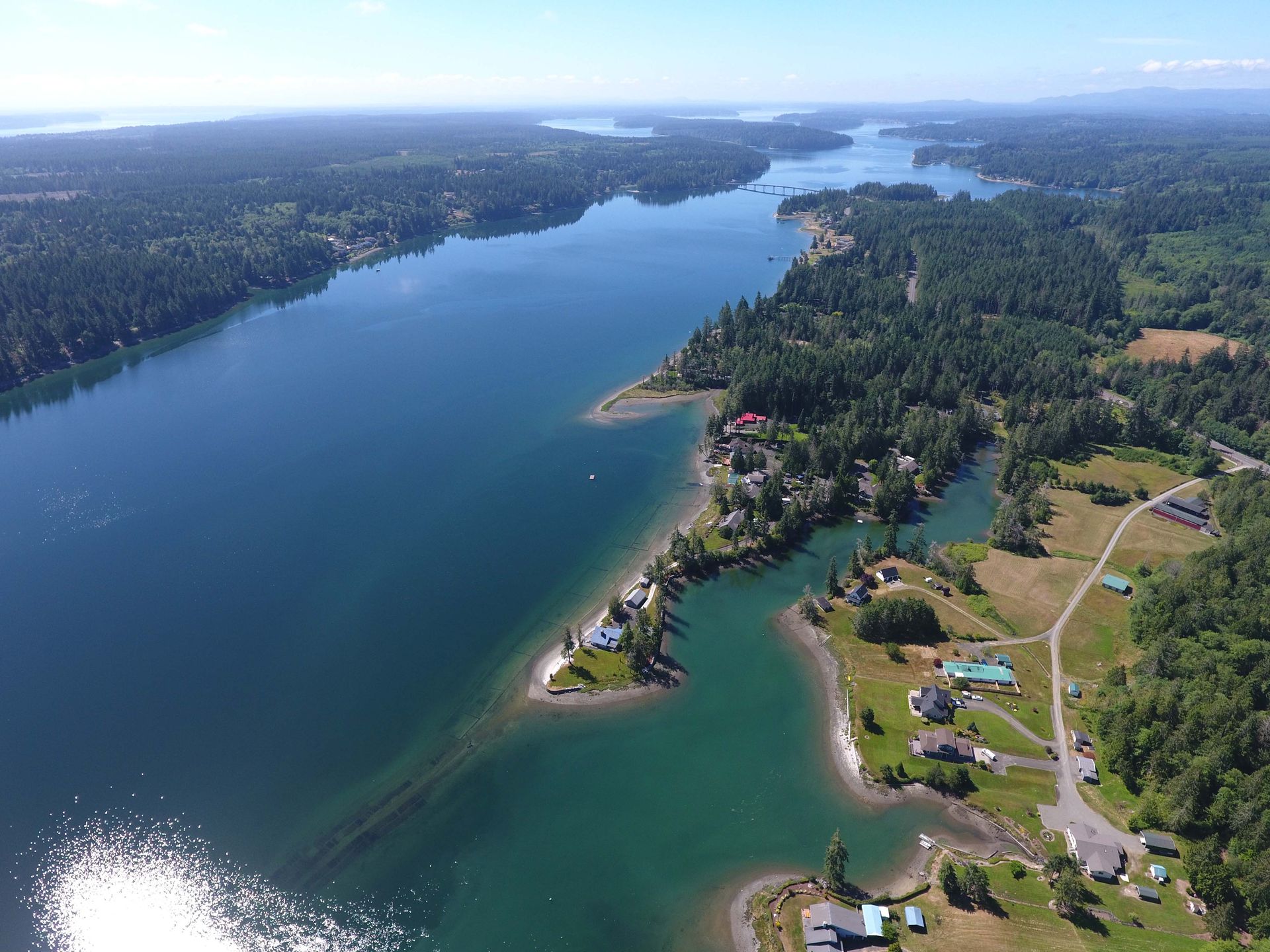 An aerial view of a large body of water surrounded by trees.