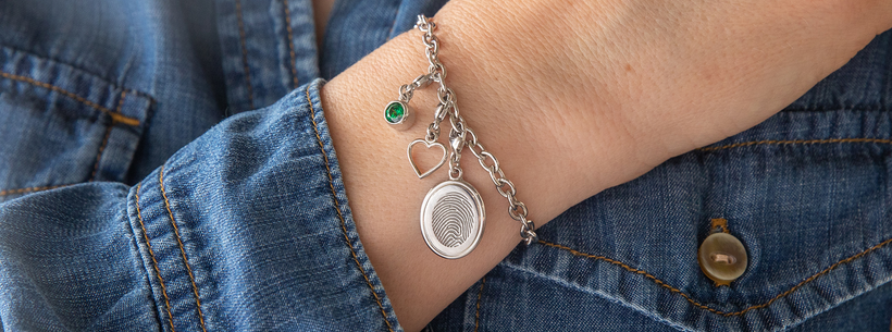 A close up of a person wearing a bracelet on their wrist.