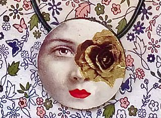 Round pendant showing woman's face with a golden rose in front of one eye.