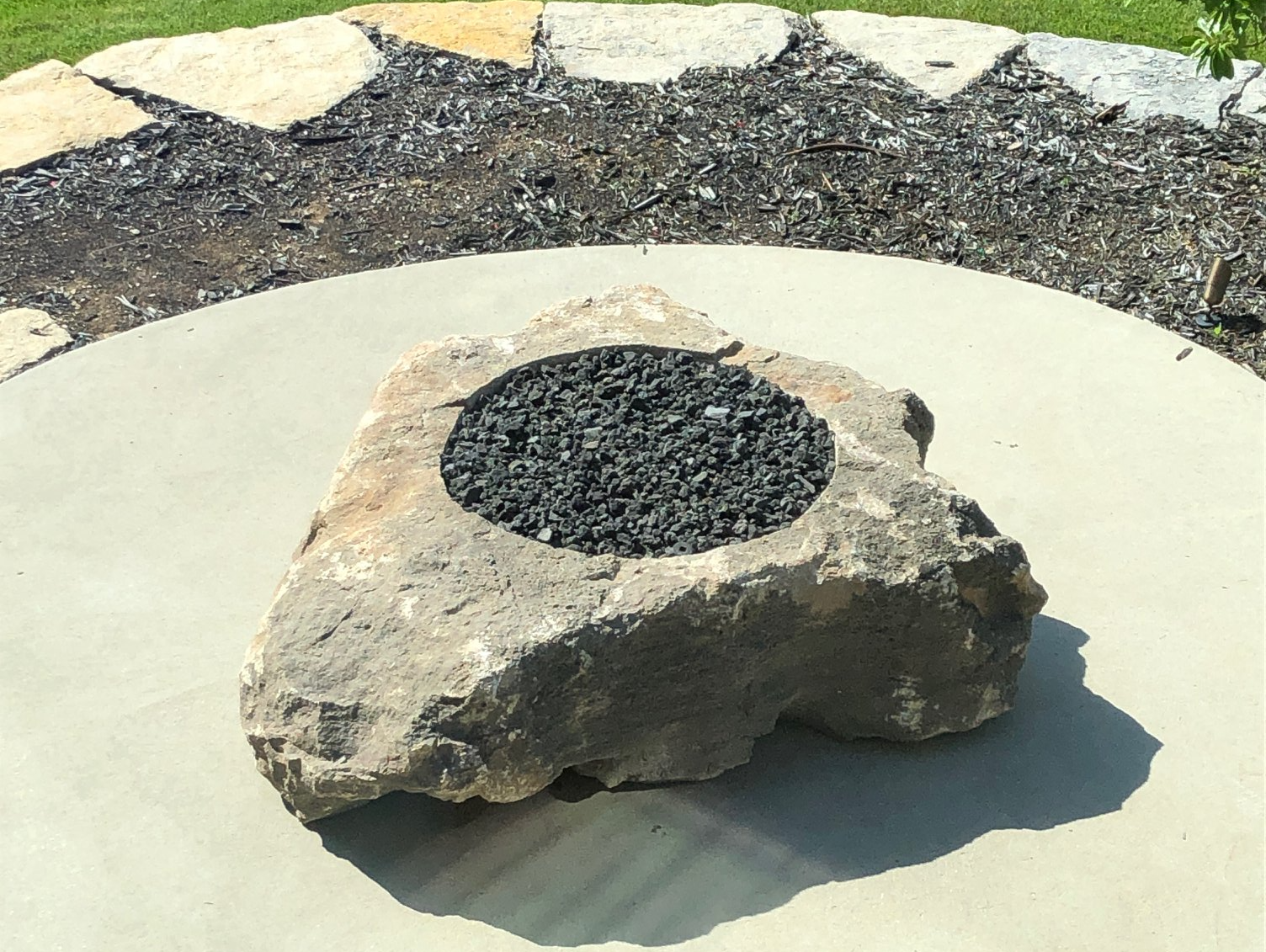 Photo of a fire boulder built by Grand River Stone