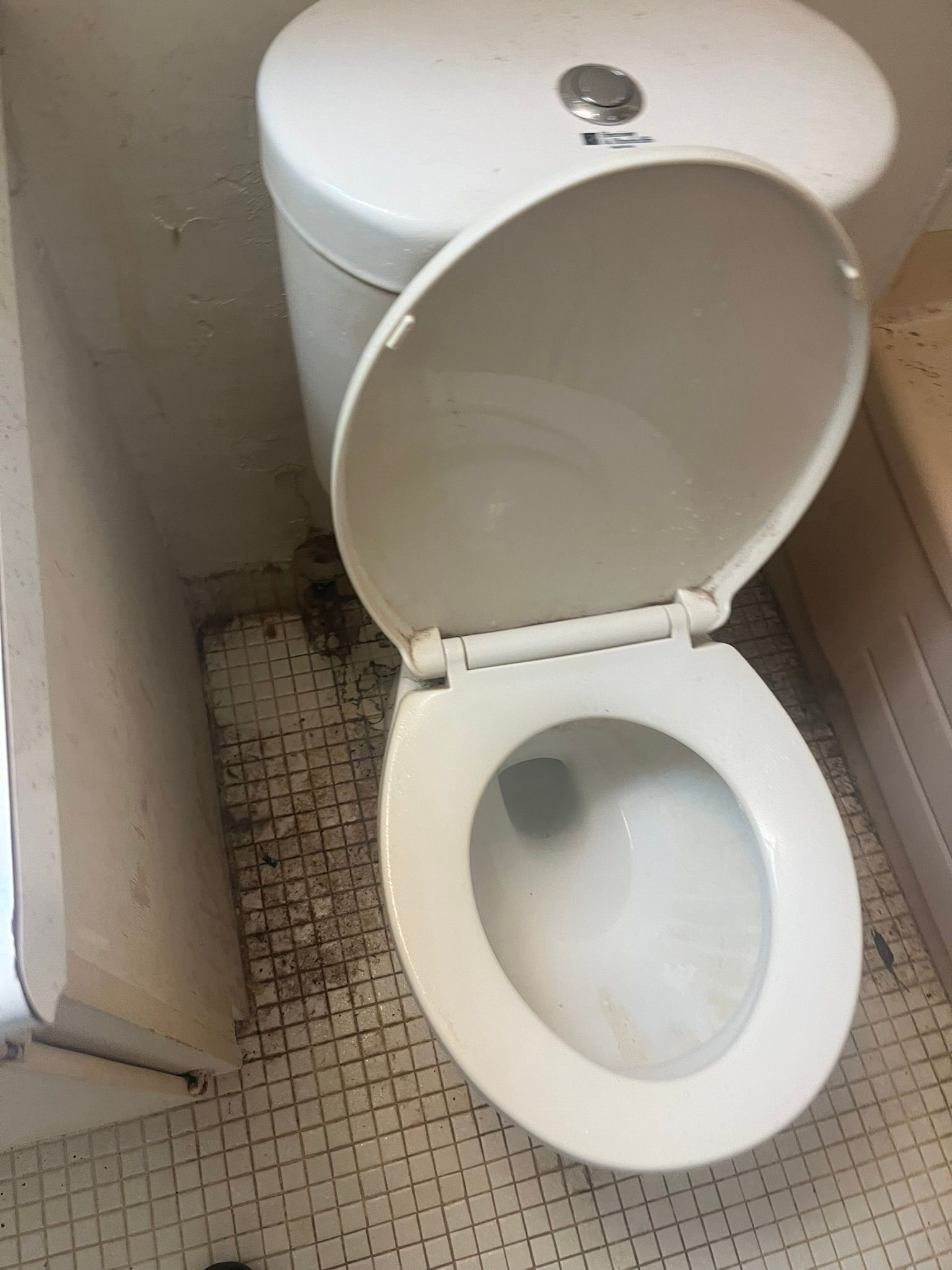 A bathroom sink with a mirror and a toilet.