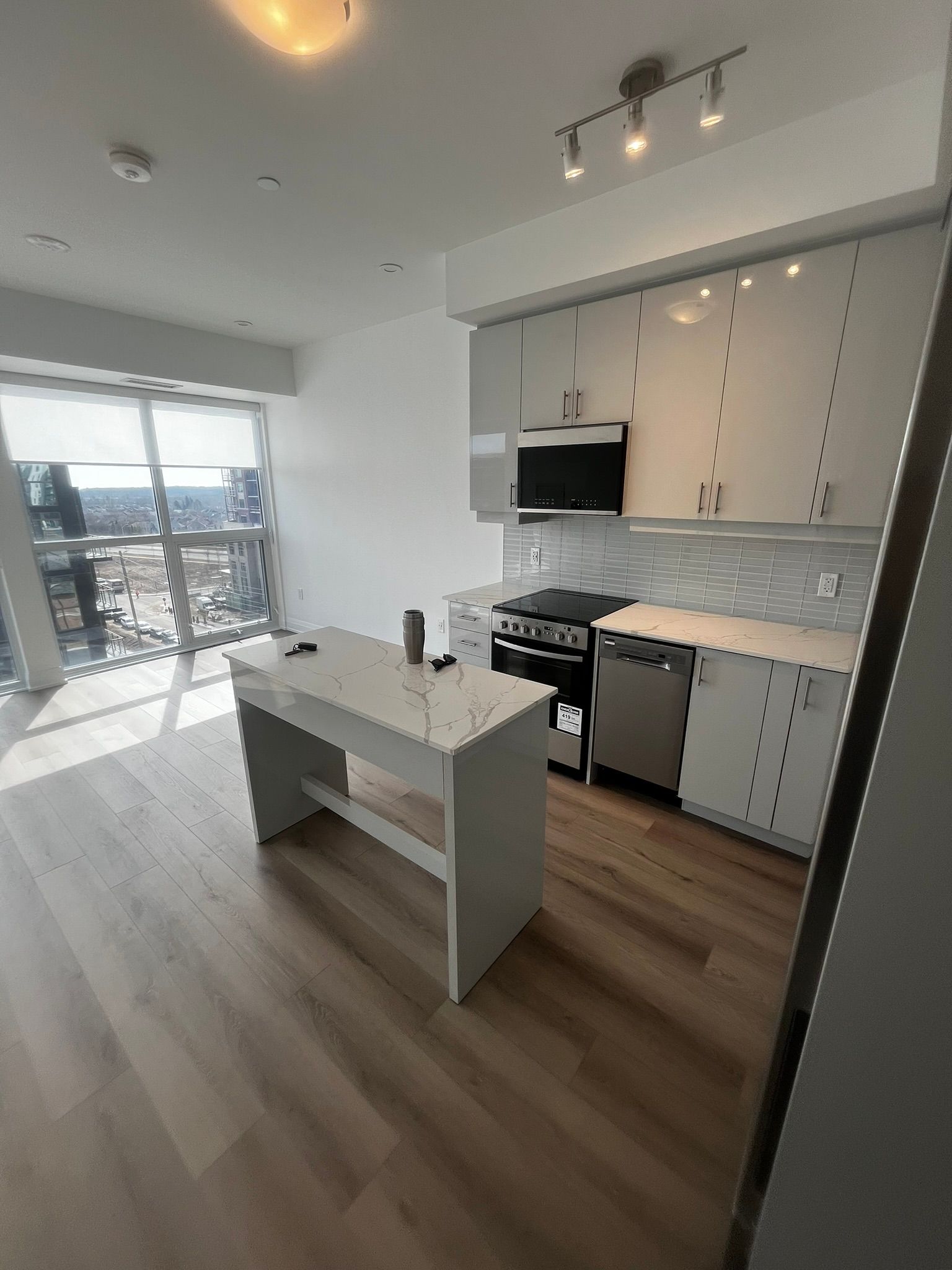 A kitchen with a large island in the middle of it