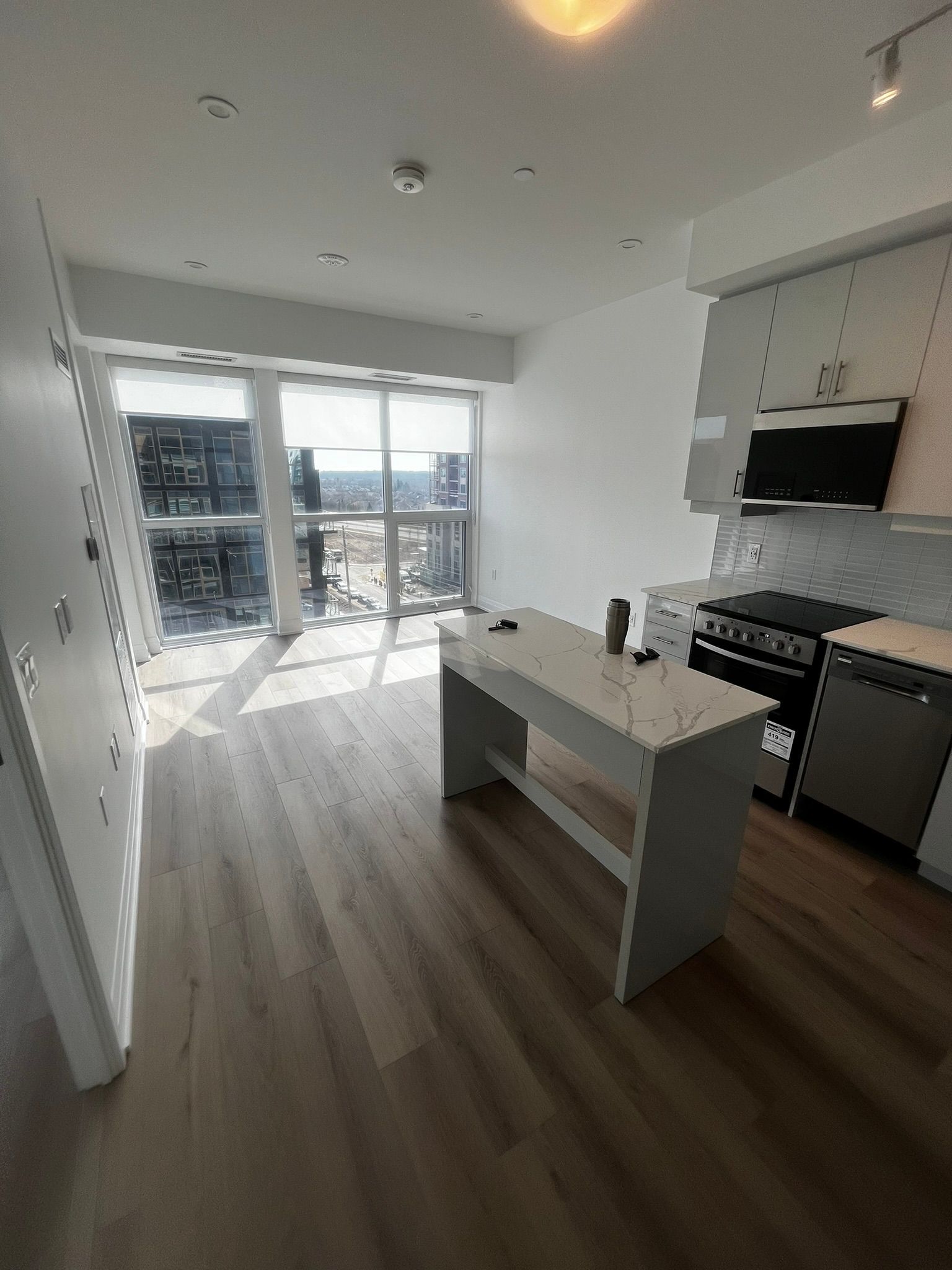 A kitchen with a large island in the middle of the room.