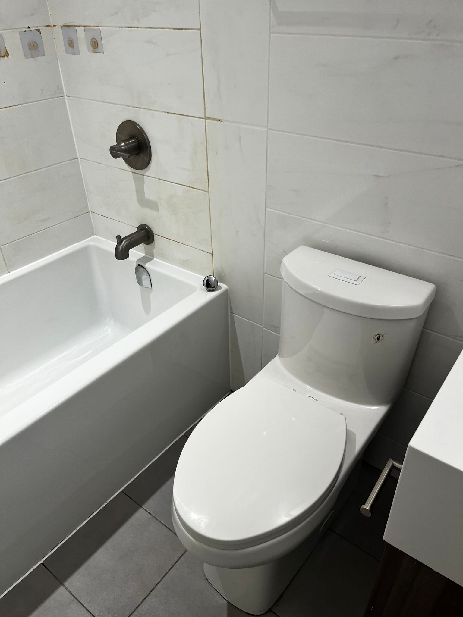 A bathroom with a toilet a bathtub and a sink