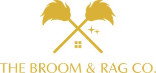 A logo for the broom and rag co. with two crossed brooms