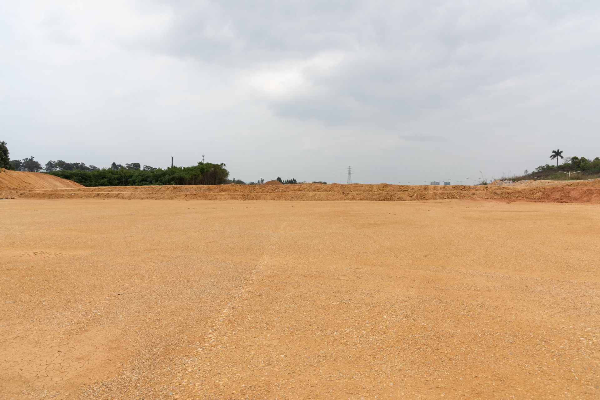 Brown dirt field under a cloudy gray sky — Australian Sandstone Products In Toowoomba, QLD