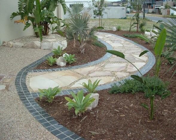 Winding Stone Pathway Through a Landscaped Garden — Australian Sandstone Products In Byron Bay, QLD