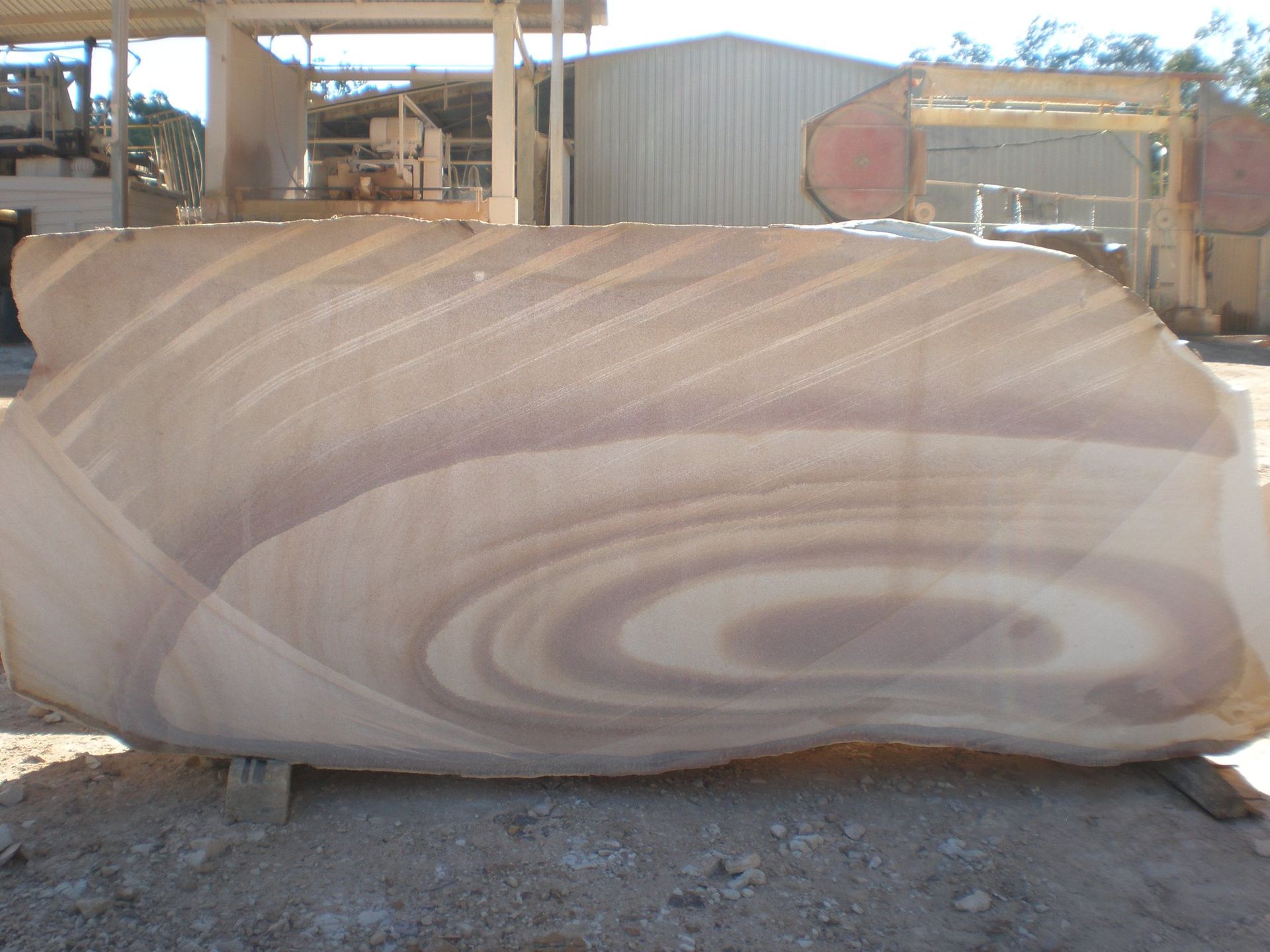 Large Sandstone Block With Swirling Light and Dark Brown Bands — Australian Sandstone Products In Noosa, QLD