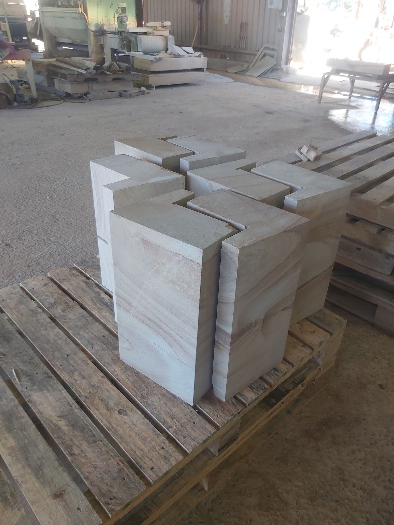 A Row Of Concrete Blocks Are Sitting In The Dirt — Australian Sandstone Products In Highfields, QLD