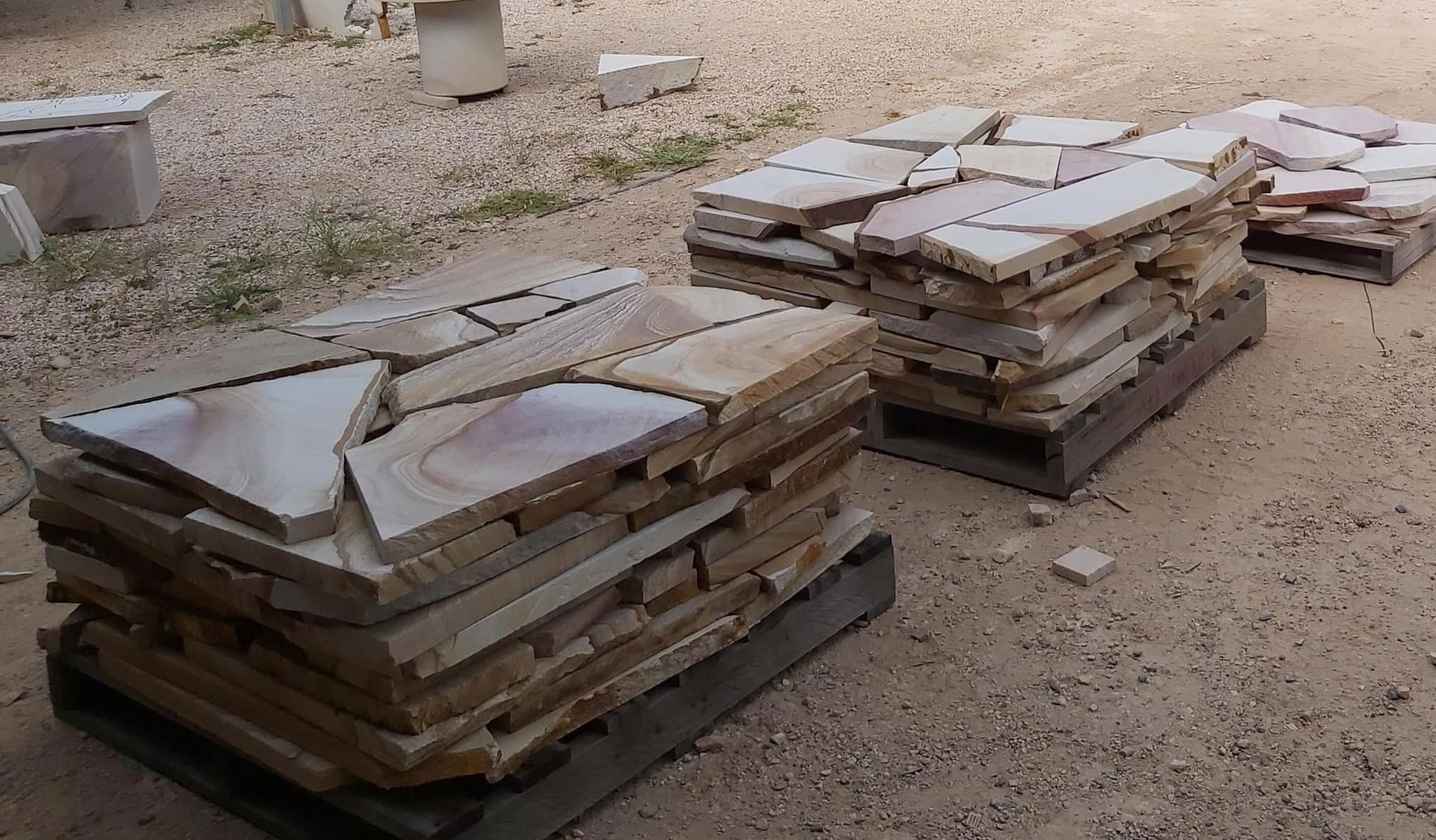 Stacks of Light Brown Stone Pavers on Pallets, Outside — Australian Sandstone Products In Ipswich, QLD