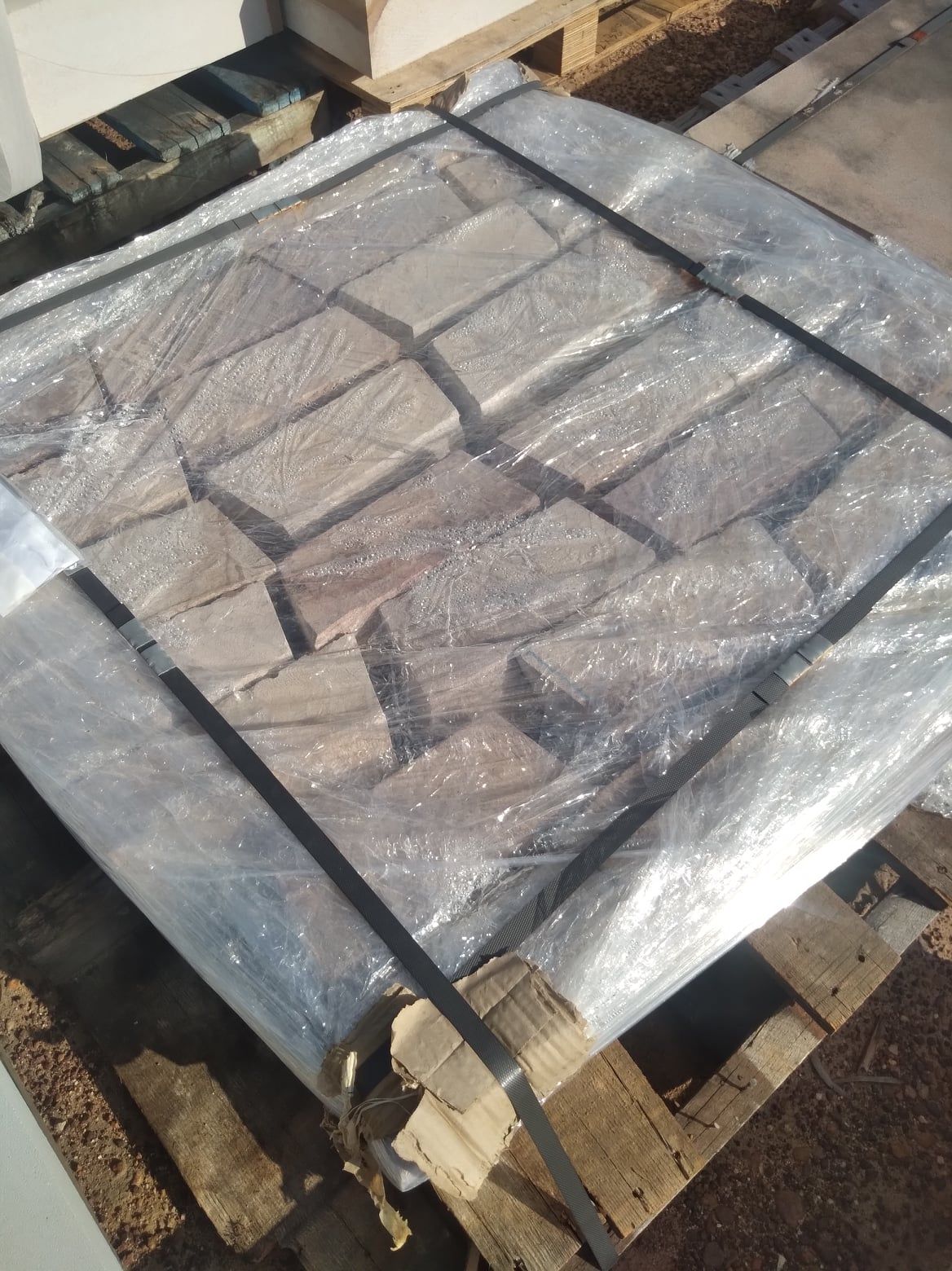 Bricks Wrapped in Clear Plastic on a Wooden Pallet — Australian Sandstone Products In Gold Coast, QLD