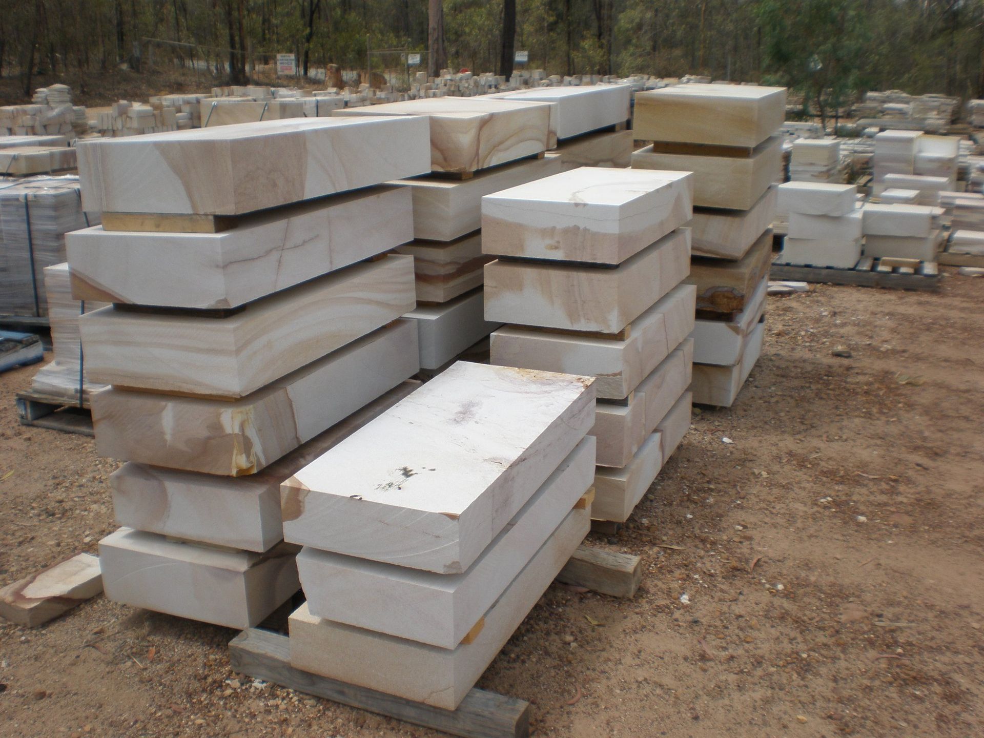 Stacks of Rectangular Beige Sandstone Blocks on Pallets — Australian Sandstone Products In Noosa, QLD