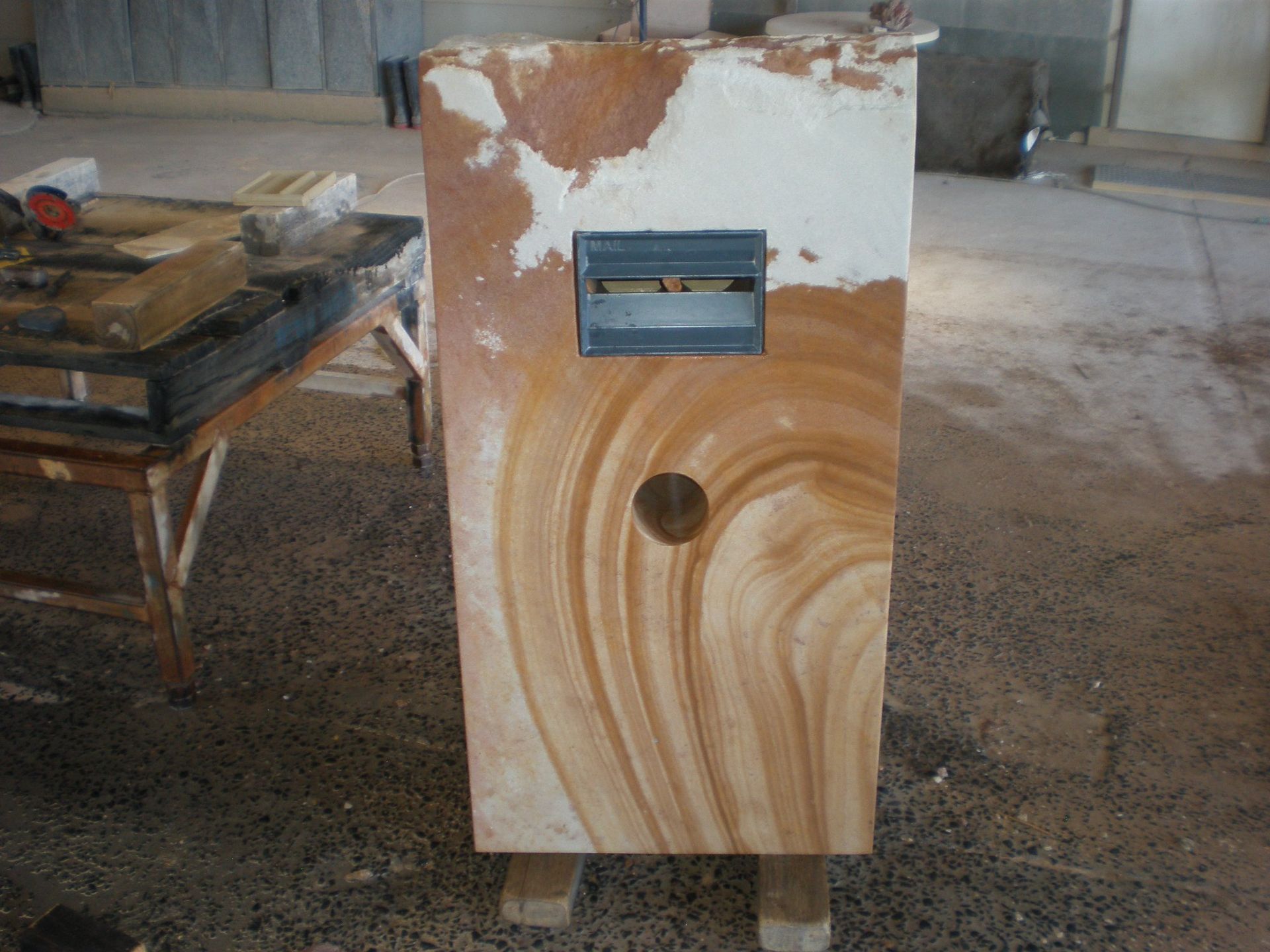 Sandstone Block With Circular Hole, Metal Box, Partially Covered — Australian Sandstone Products In Warwick, QLD