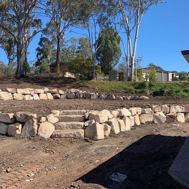 Stone Wall With Stairs Leading Up to a House in the Background — Australian Sandstone Products In Helidon, QLD