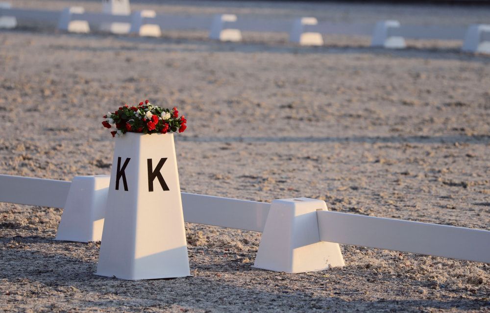 A White Cone With The Letter K On It Is Sitting On Top Of A Dirt Field — Australian Sandstone Products In Helidon, QLD