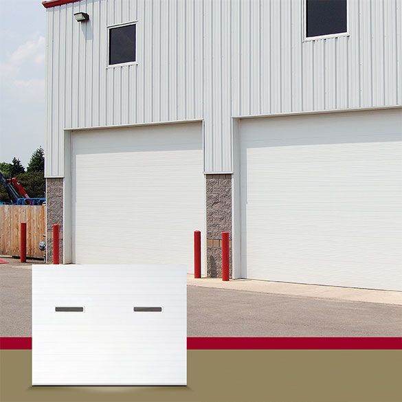 A picture of a white garage door on a building