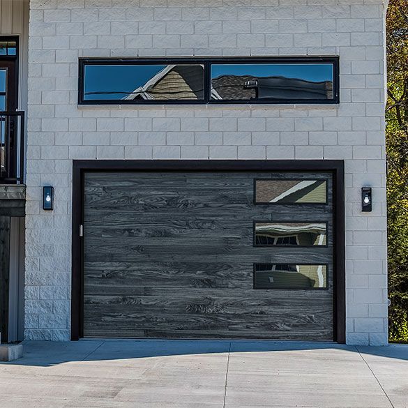 The garage door is made of wood and has a lot of windows.