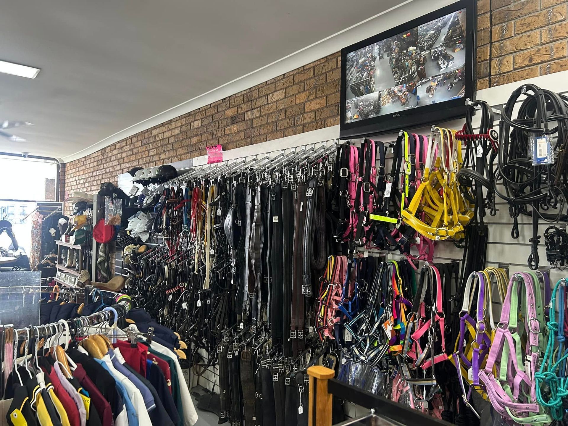 A store filled with lots of clothes and horse equipment. — Paint Horse Saddlery In Taree, NSW