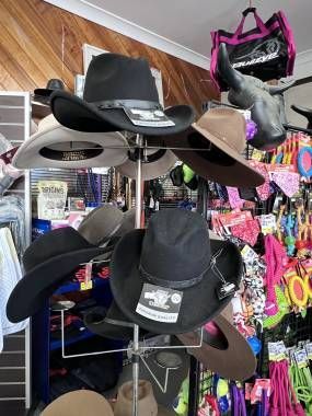 A store filled with lots of hats and helmets. — Paint Horse Saddlery In Taree, NSW