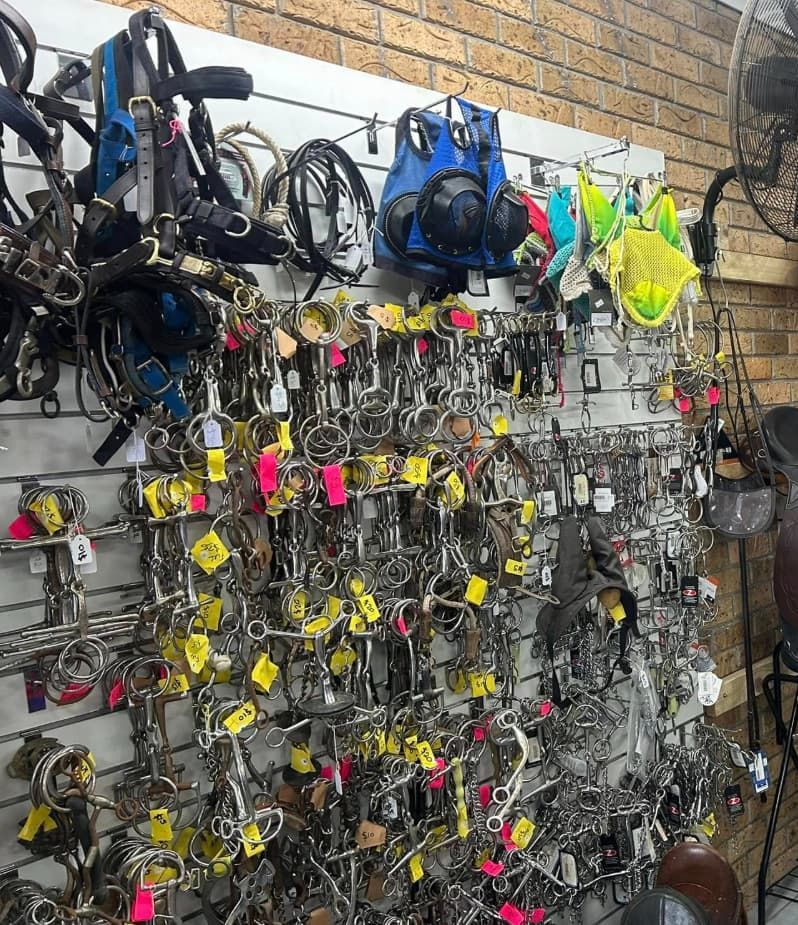 A wall filled with lots of keys and bridles. — Paint Horse Saddlery In Taree, NSW