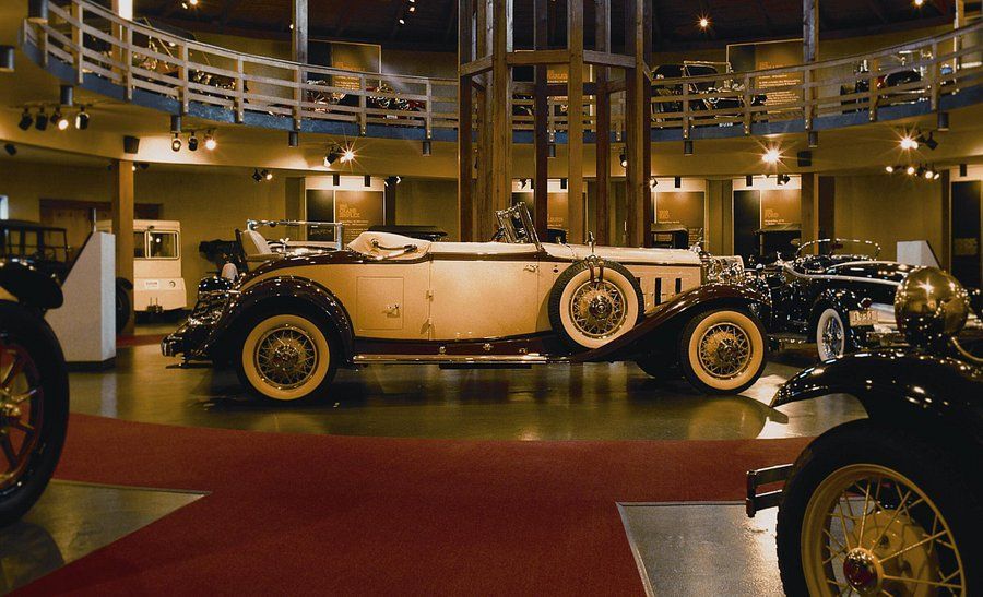 An old car is on display in a museum