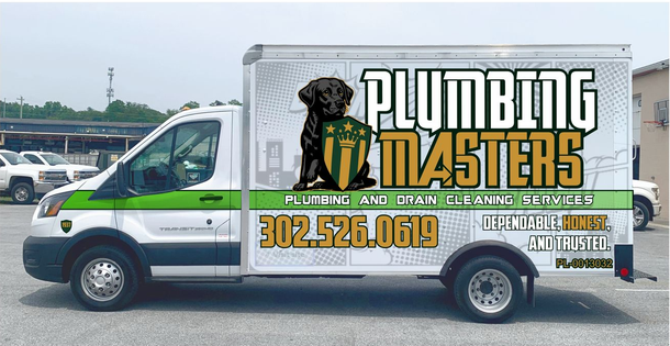 A man and two women are standing next to each other holding cleaning supplies.