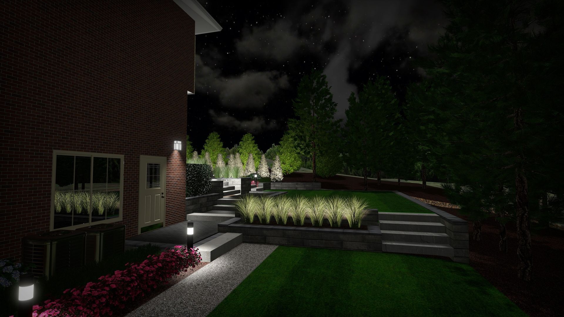 Nighttime view of a brick house with illuminated landscaping: steps, shrubs, and a grassy lawn.