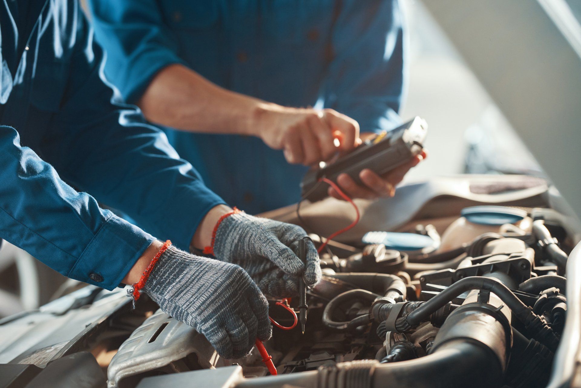 Mechanic Checking Car Battery — Easton, SC — Sheriff Import Services