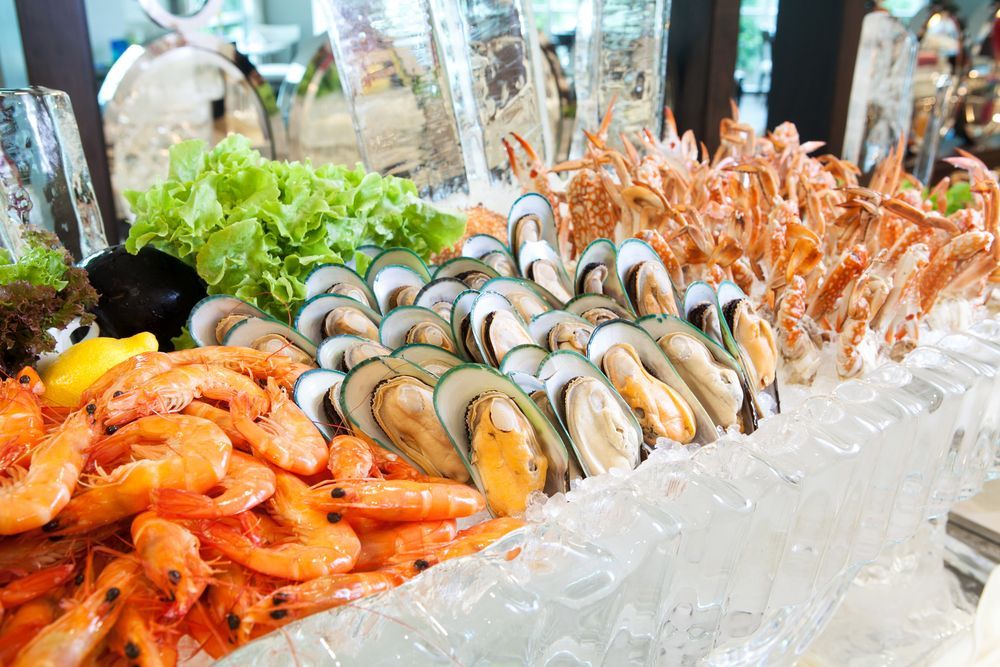 Seafood Buffet with Shrimp, Mussels, Crab Legs, and Lettuce on Ice — YKnot Cruises in Nelson Bay, NSW