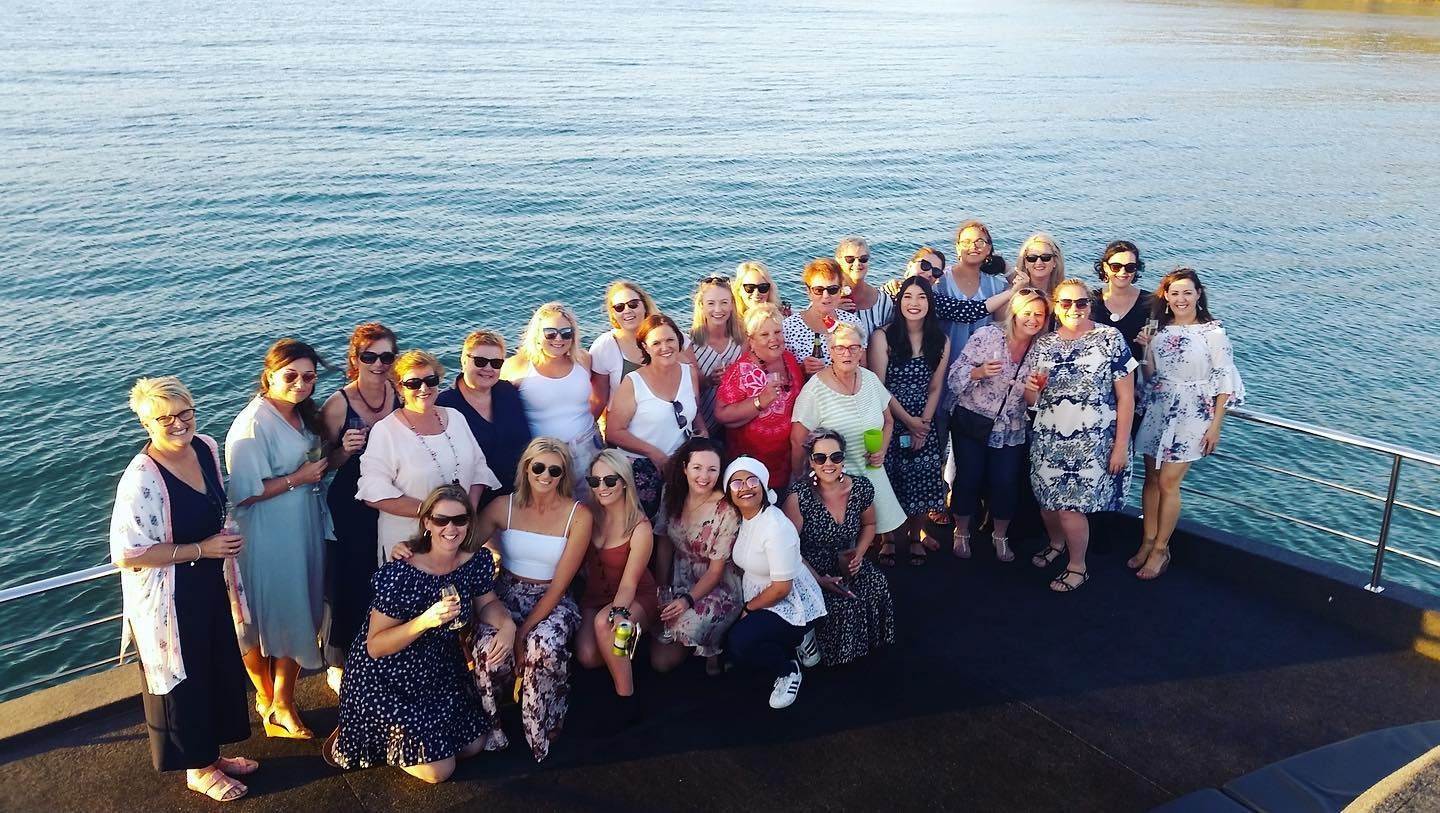 Women at A Hen Party Looking at An Engagement Ring, Celebrating in A Bar — YKnot Cruises in Nelson Bay, NSW