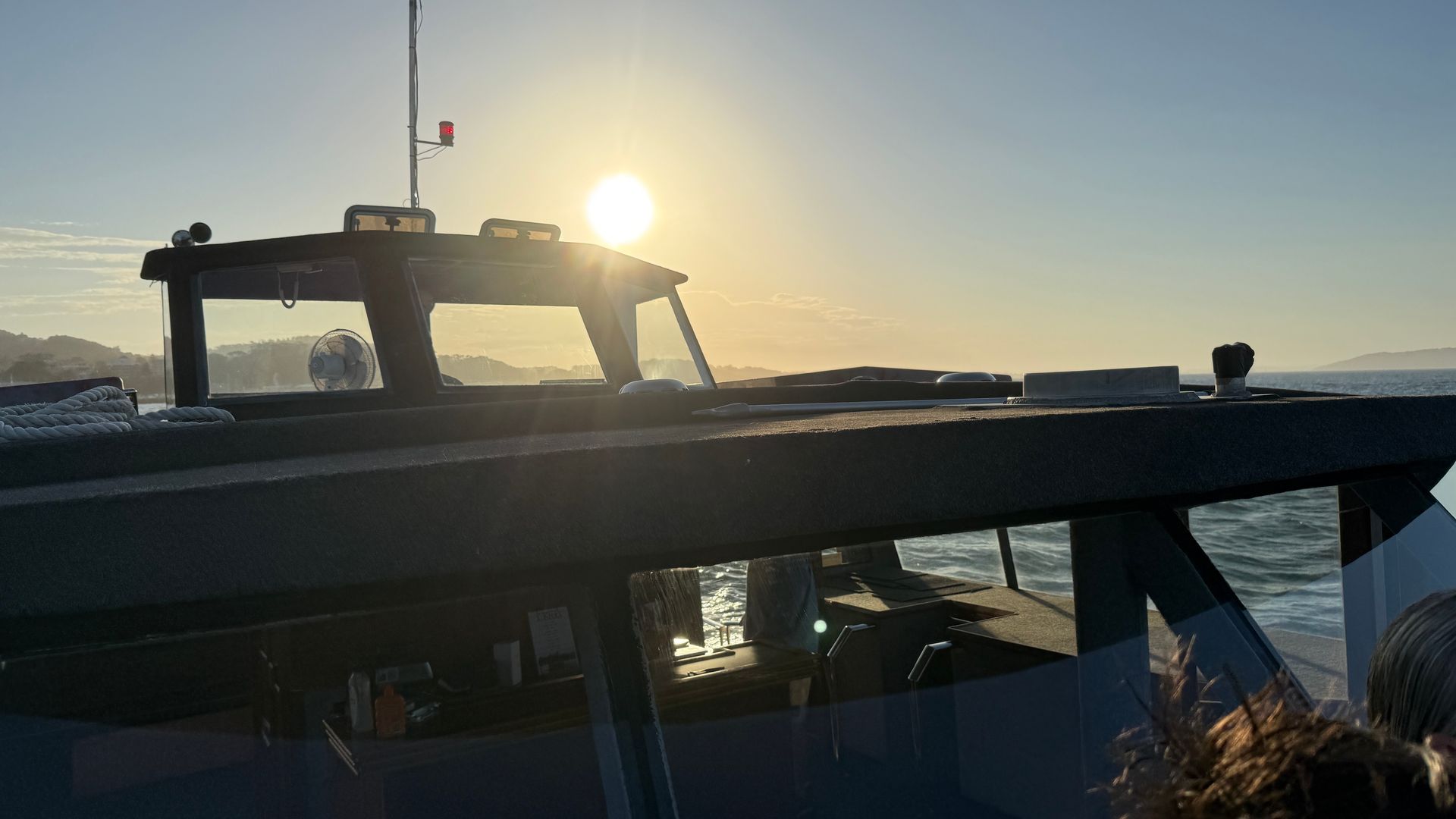 Sunset Over Ocean, Orange Sun, Ripples on Water — YKnot Cruises in Nelson Bay, NSW