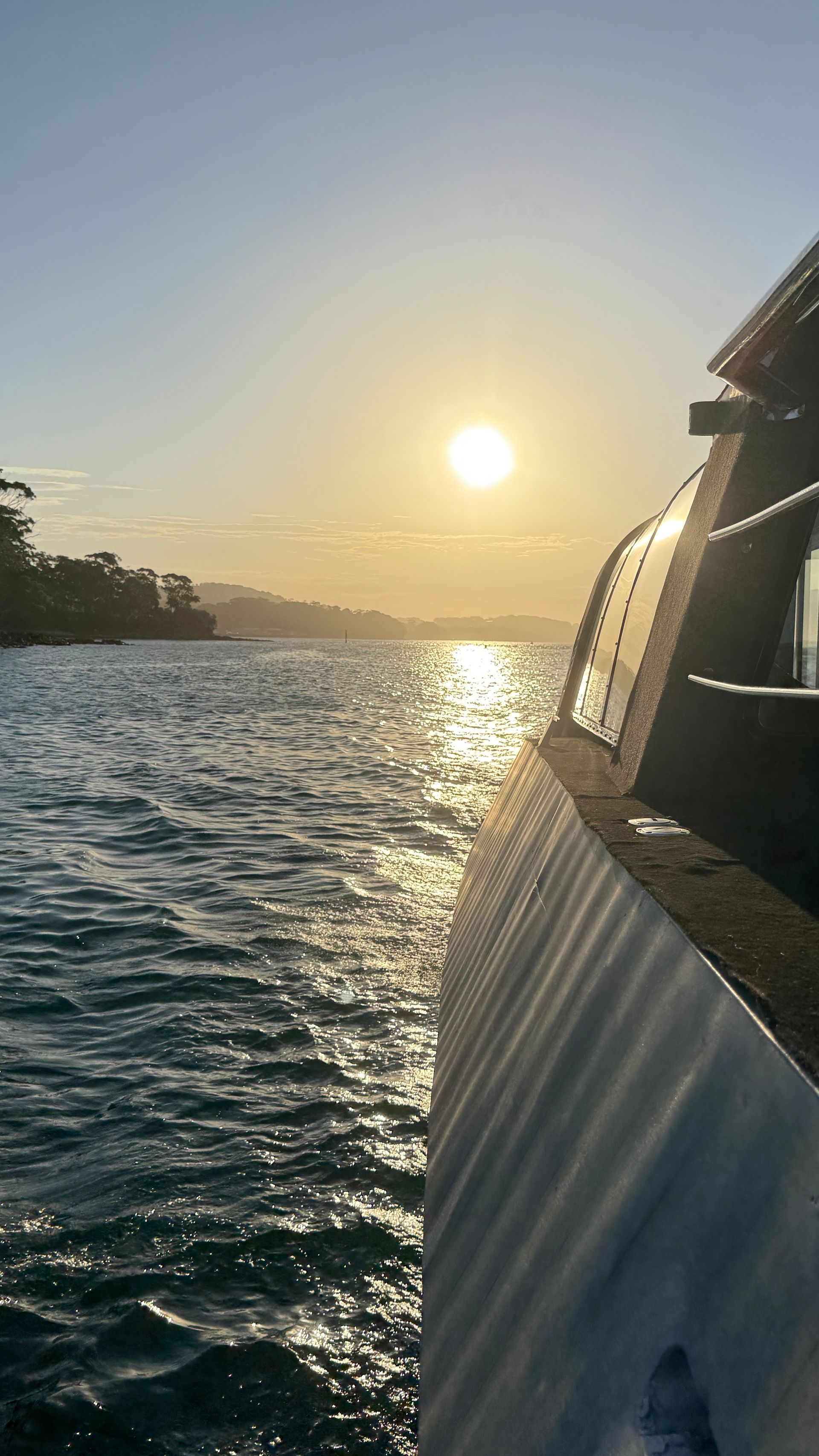 Boat Sailing on Water with Sunset in The Background — YKnot Cruises in Nelson Bay, NSW