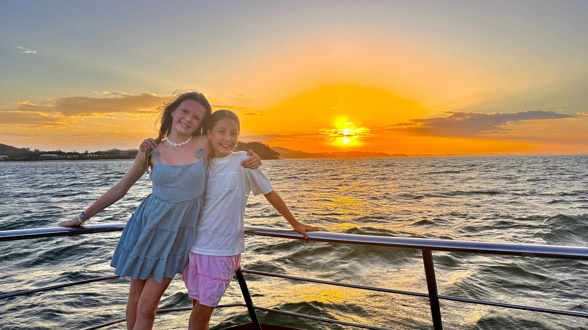 Outdoor Restaurant on A Dock with Diners Seated at Tables Under a White Canopy — YKnot Cruises in Nelson Bay, NSW