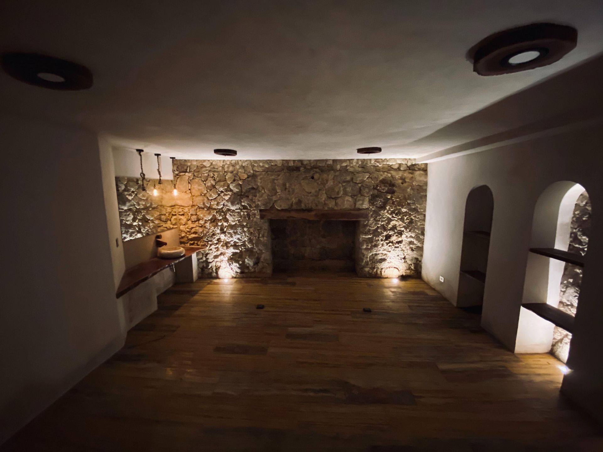 There is a fireplace in the middle of the room.