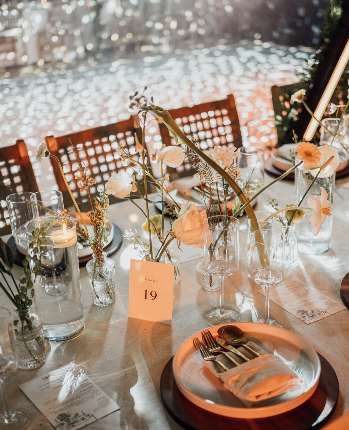 A large lawn with a stone building in the background