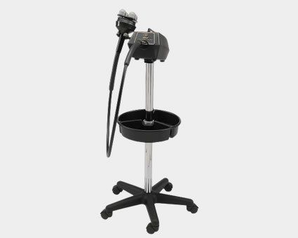 Black salon hair steamer on a wheeled stand with a tray.