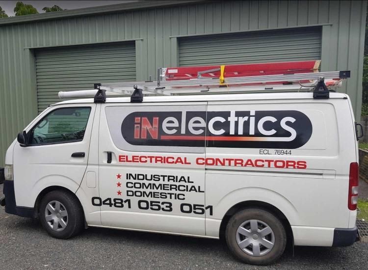 Two Construction Workers Are Working On A Crane — In Electrics In Babinda, QLD