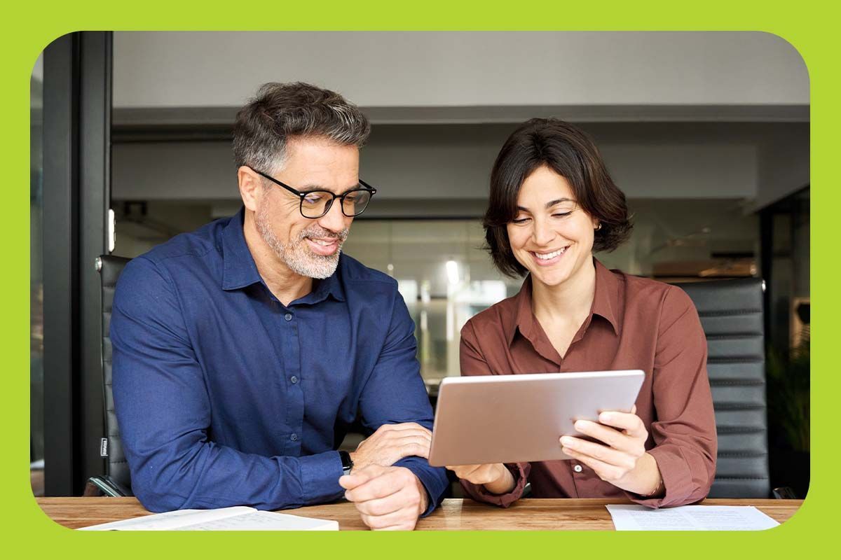 Couple looking at a tablet together