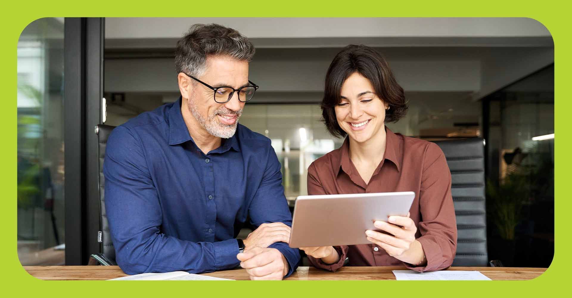 A couple looking at a tablet together