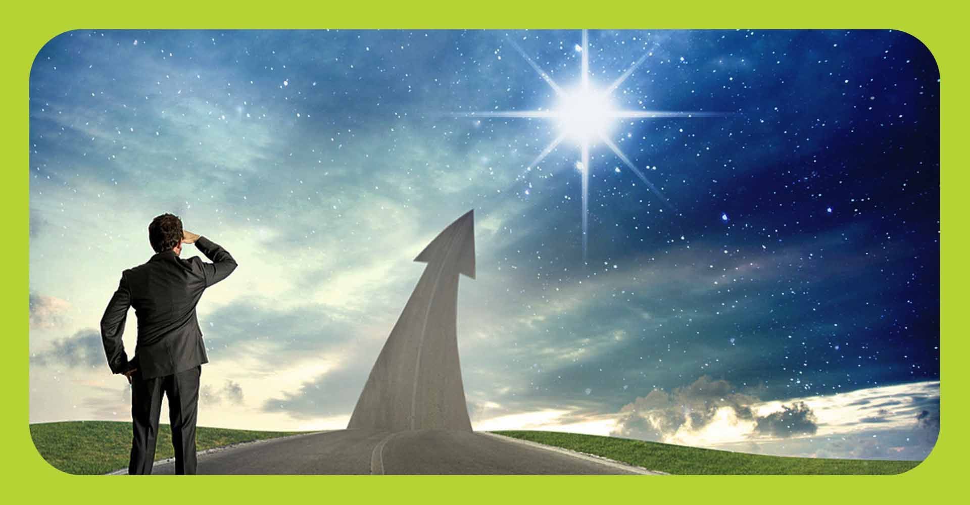 A man looking ahead to a road that points upwards to a North Star