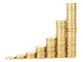 A stack of gold coins stacked on top of each other on a white background.